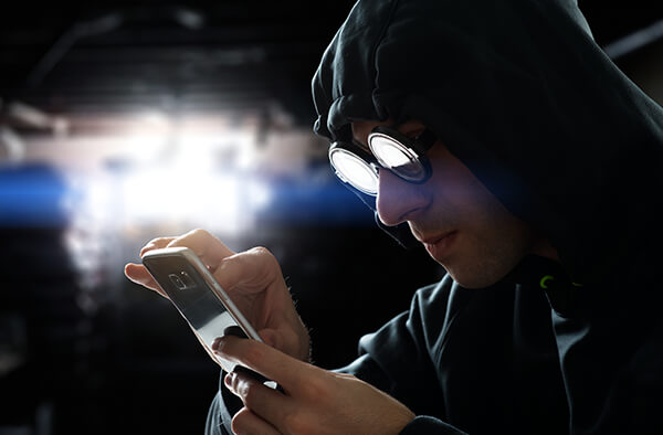 Shady character with phone